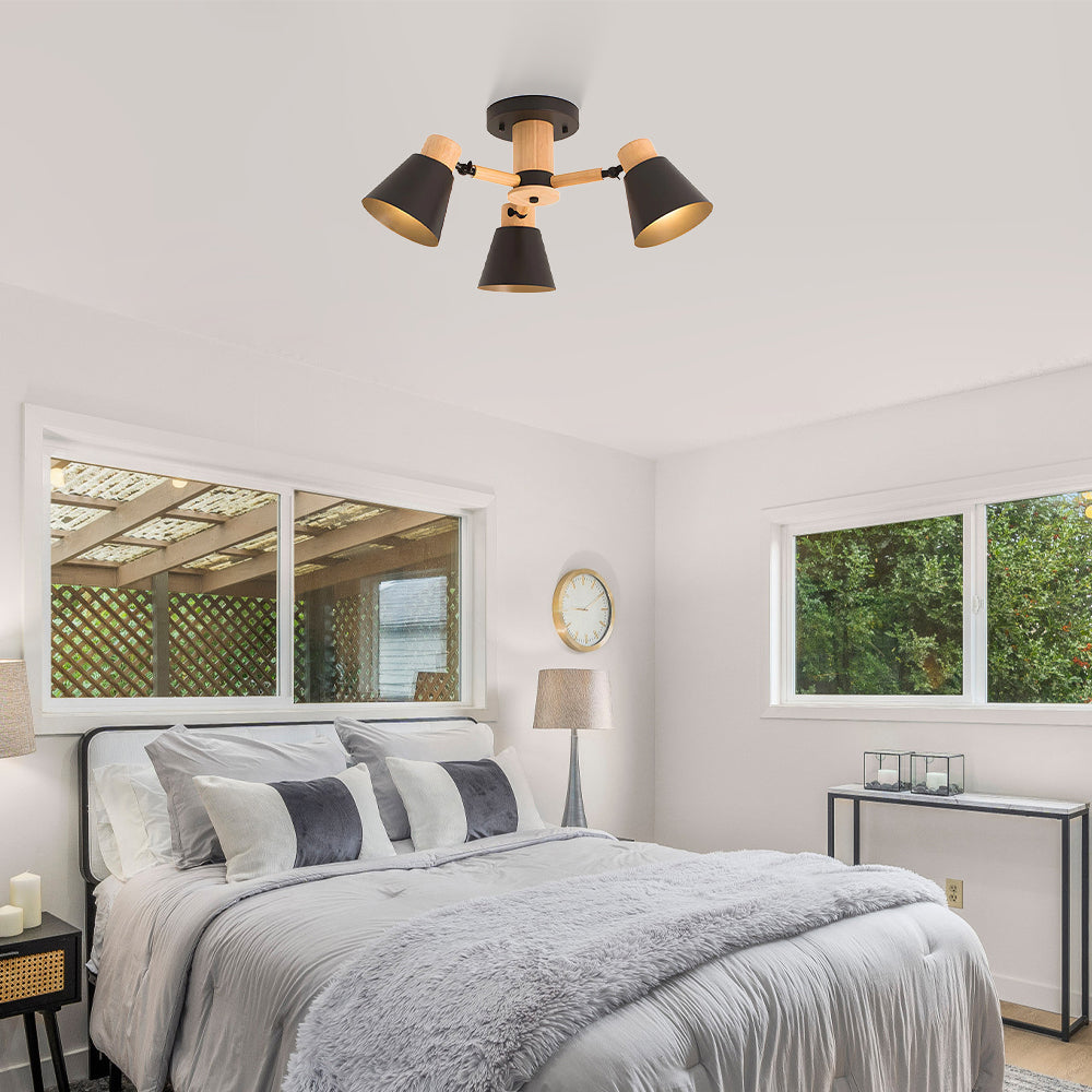 Modern bedroom with a ceiling light fixture, bed, and windows.