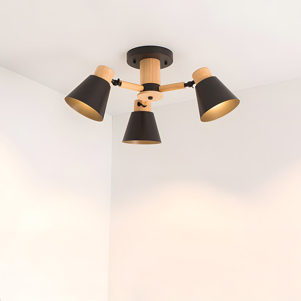 Modern ceiling light fixture with three black lampshades on a white background