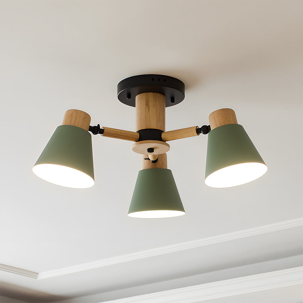 Ceiling light fixture with three green lampshades and wooden accents on a white ceiling.