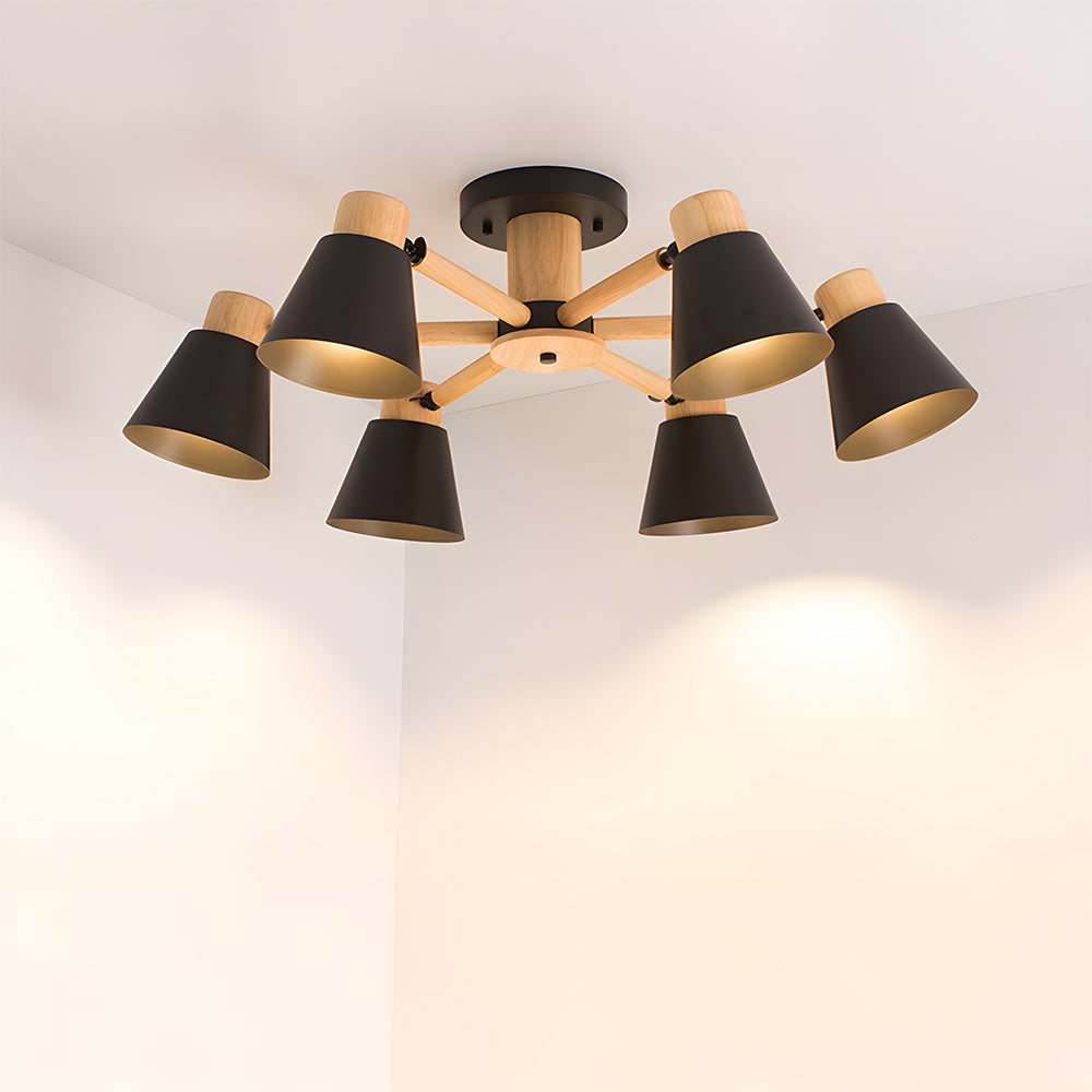 Modern ceiling light fixture with black and wood design on a white ceiling.