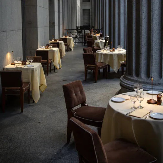 Dining room with tables set for meals in a formal setting