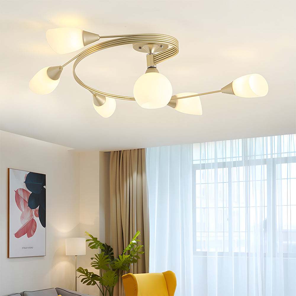 Modern ceiling light fixture in a living room setting with a yellow chair and plant.