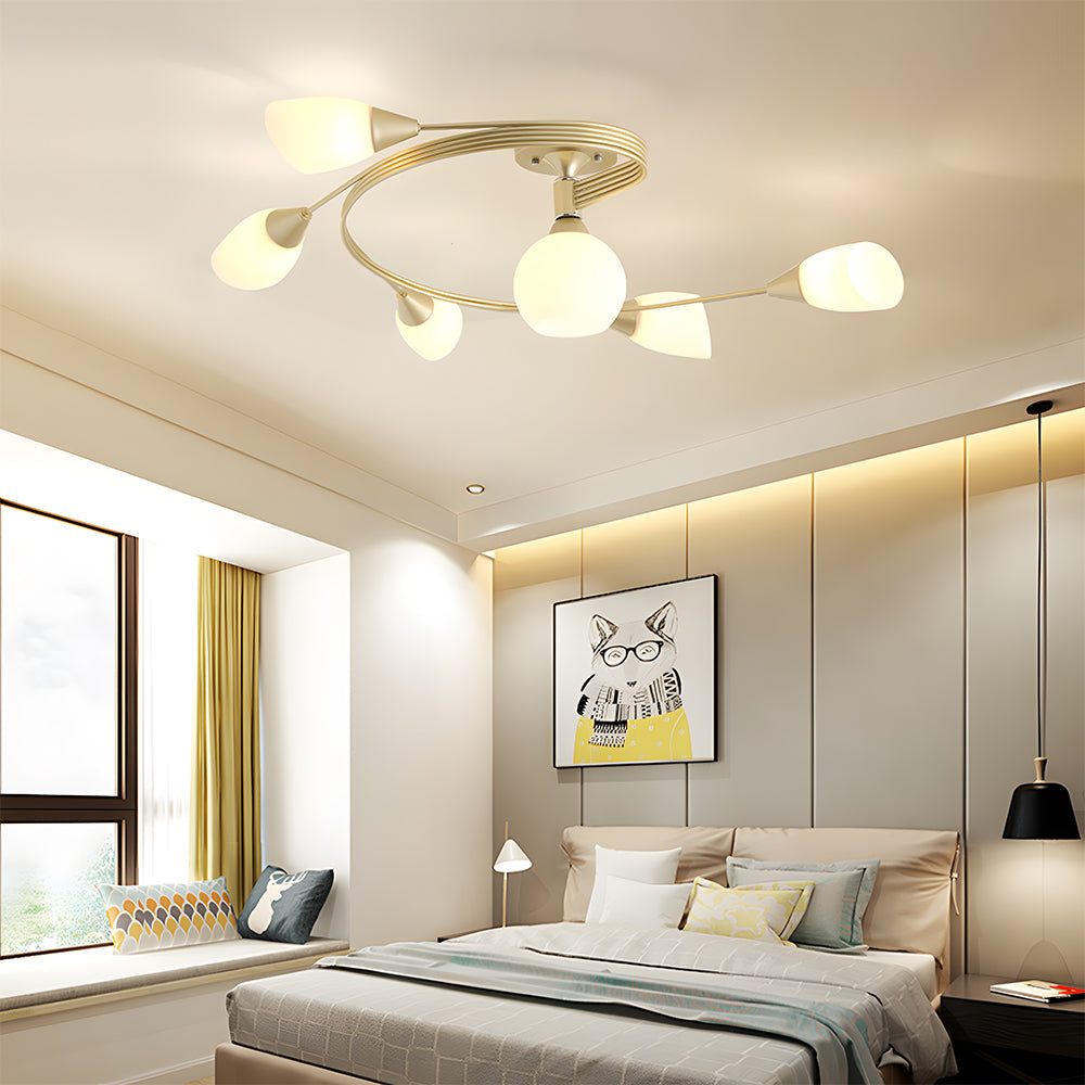 Modern bedroom with ceiling light fixture, bed, and decor