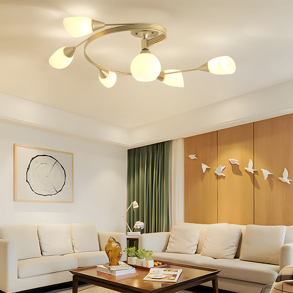 Modern living room with a ceiling light fixture, beige sofa, and decorative elements.