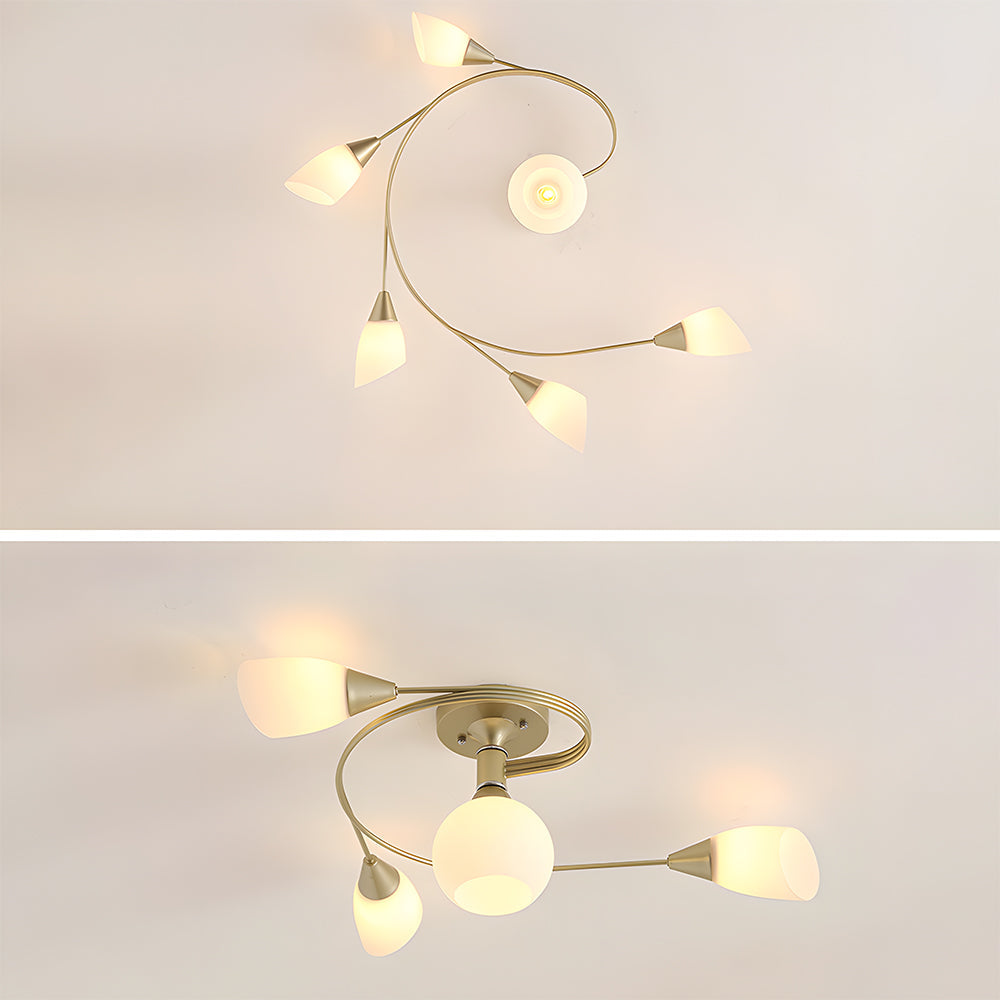 Modern ceiling light fixture with gold finish and white glass shades on a plain background.