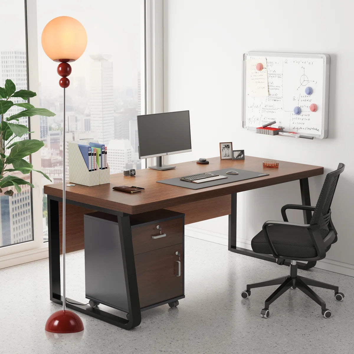 Modern office desk setup with a chair, lamp, and computer monitor.
