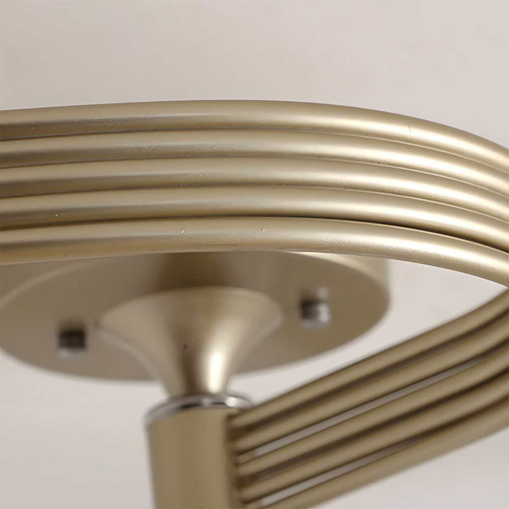 Close-up of a gold ceiling light fixture on a white background