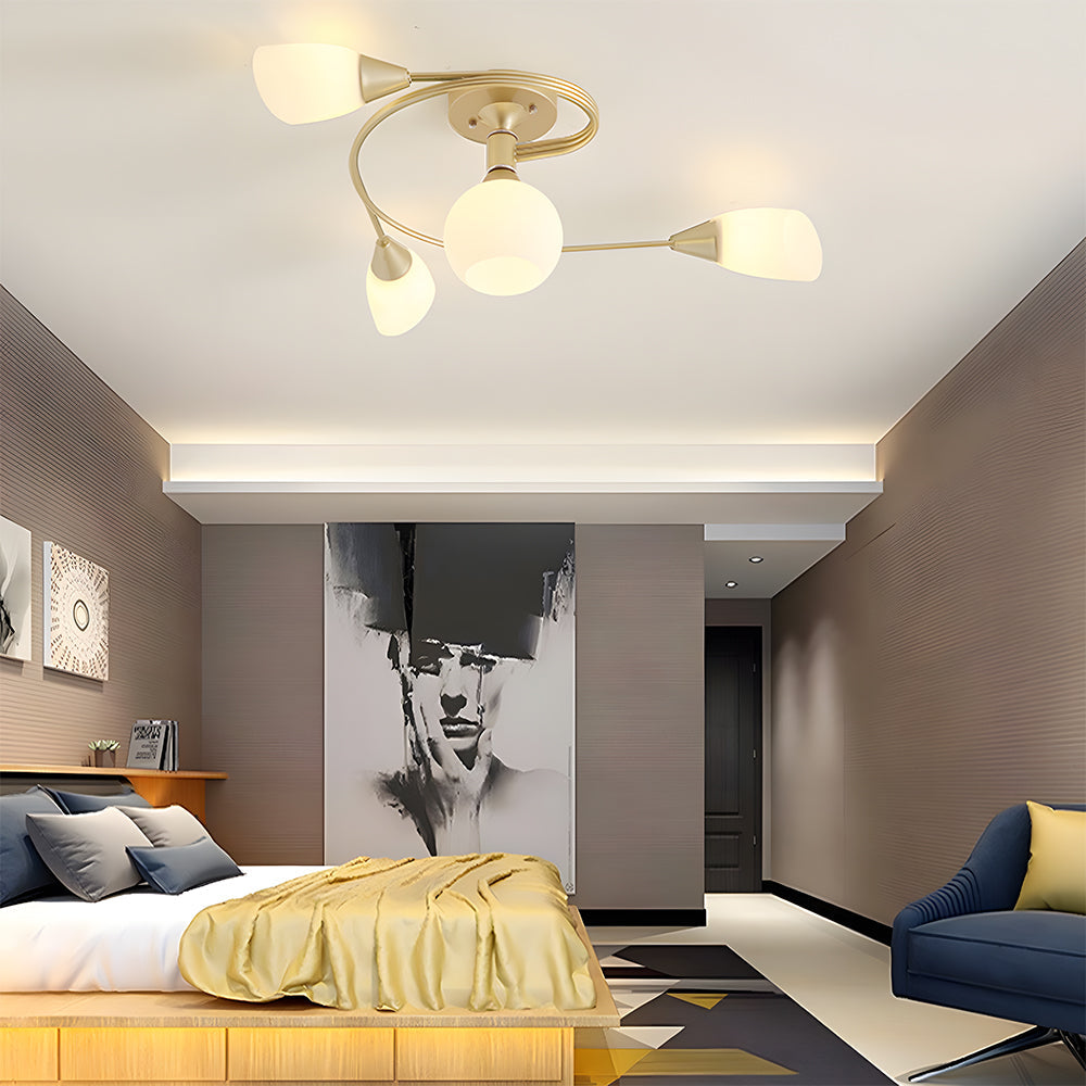 Modern bedroom with a ceiling light fixture, bed, and wall art.