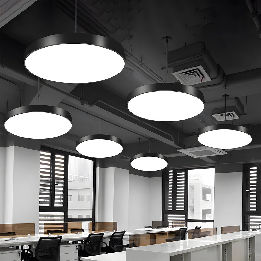 Modern office interior with multiple round pendant lights.