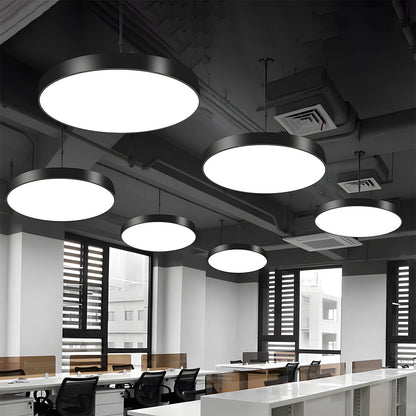 Modern office interior with multiple round pendant lights.