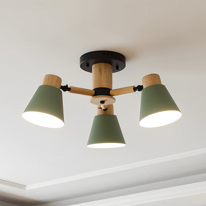 Ceiling light fixture with three green lampshades and wooden accents on a white ceiling.
