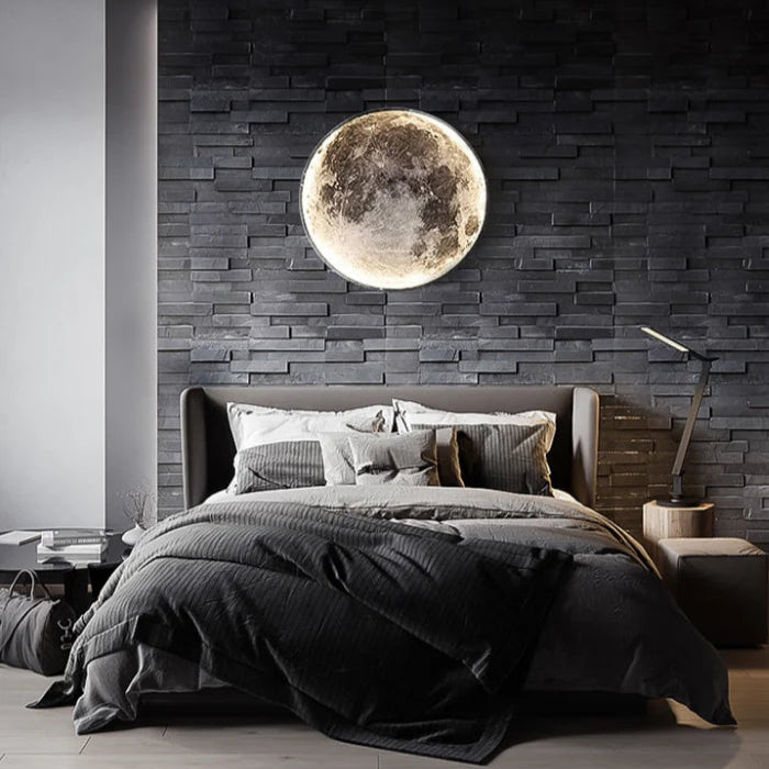 Modern bedroom with a large moon wall decoration on a dark brick wall.