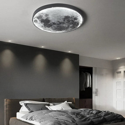 Modern bedroom with a moon-shaped ceiling light fixture.