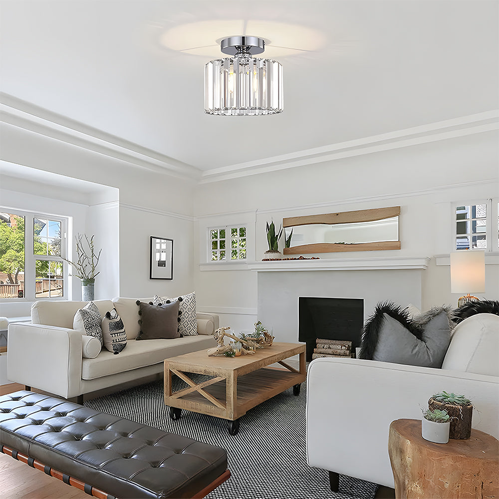 Modern living room with white sofas, a coffee table, and decorative elements.