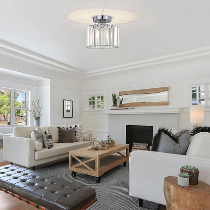 Modern living room with white sofas, a coffee table, and decorative elements.