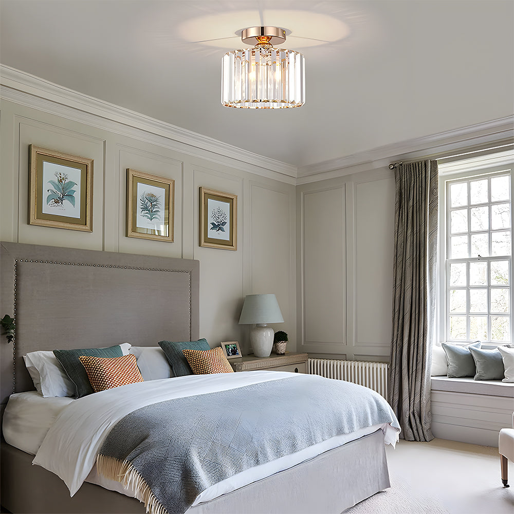 Neatly made bed in a bedroom with decorative pillows and wall art.