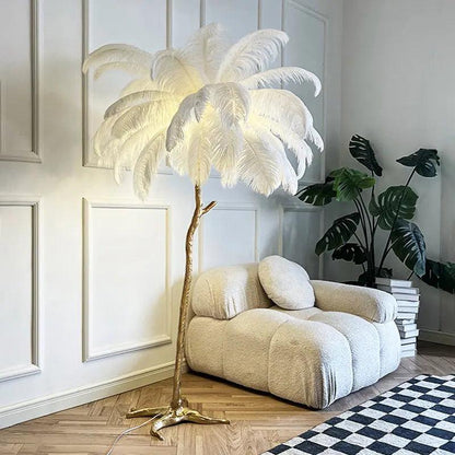 Feathered floor lamp in a modern living room with a white armchair and decorative plants.